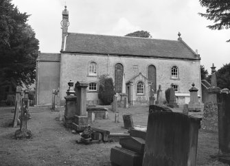 View from SSW showing churchyard and S front of Kirkmichael Parish Church, Patna Road, Kirkmichael.