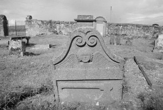 View of undated gravestone for Wright with winged soul and axe in Madderty churchyard.