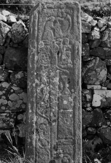 Detail of West Highland medieval graveslab bearing sword, harpist, chalice and panel of interlace, St Comgan's Chapel, Glendale, Isle of Skye.