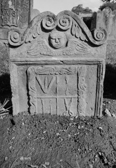View of gravestone for Robert Wright (died 1717) in the churchyard of Dunbarney Parish Church.
Reverse of stone displaying winged soul and craft symbols.