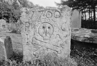 View of headstone dated 1700 and inscribed 'RC IC' in the churchyard of Old Logie Church.