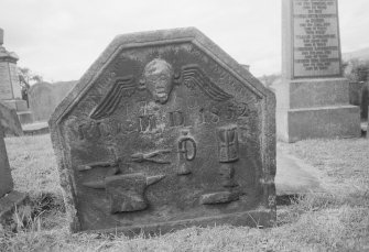 View of gravestone dated 1730 and 1852 commemorating a smith in the churchyard of Kilsyth Parish Church.