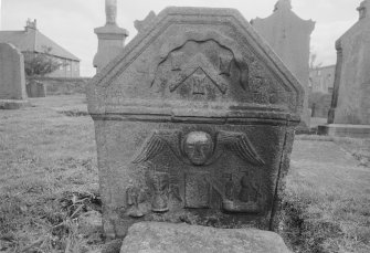 View of West face of gravestone commemorating mason with initials 'AH EC' 1731 in the churchyard of Kilsyth Parish Church.