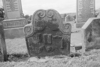 View of gravestone commemorating weaver c1730-40 in the churchyard of Kilsyth Parish Church.