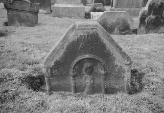 View of gravestone inscribed 'AH' and 1728 in the churchyard of Kilsyth Parish Church.