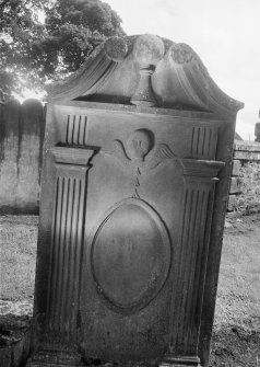View of gravestone commemorating James Munzie in the churchyard of Half Morton Parish Church.