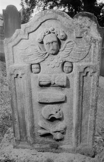 View of gravestone commemorating John Kellock and Jane Faines, 1795, in the churchyard of Half Morton Parish Church.