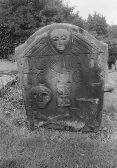View of gravestone inscribed 'IG IG TG MG' 1754 in the churchyard of Old Logie Church.