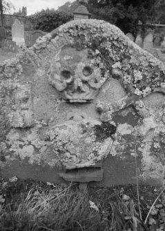 Detail of gravestone inscribed 'TC MC' 1733 in the churchyard of Old Logie Church.