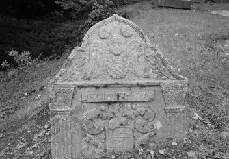 View of gravestone commemorating John Guthrie, 1744, in the churchyard of Lundie Parish Church.