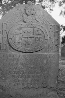 Detail of gravestone with initials 'I D E B' and dated 1729 in the churchyard of Farnell Parish Church.