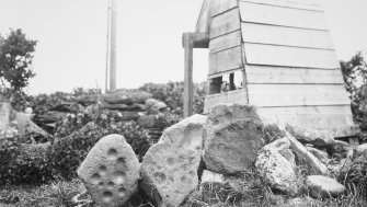 RCAHMS. Photograph of Cup-marked Stone (Now at Nybster)