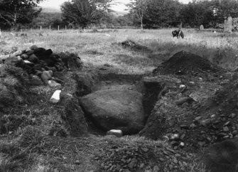 Excavation Photograph: Stone under excavation.