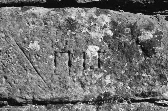Detail of dated stone (1711) in S face of S wall of mill.