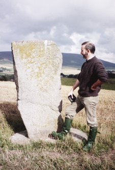 View of Craw Stane from SW; Dr Iain Fraser (RCAHMS) in picture