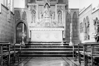 Interior view of chapel in Hospital for Incurables (St Mary's Sisterhood Episcopal Church), Dundee, showing altar and carved altarpiece.