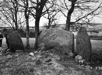 The recumbent and flanking stones; Dr I Fraser (RCAHMS) on left of picture.