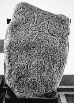General view of Pictish stone bearing a large double disc and Z-rod, and traces of a second, possibly circular, symbol.