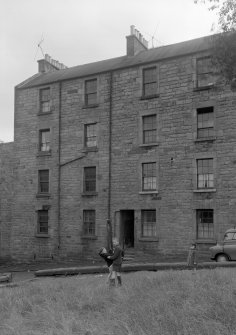 General view of 7, 9, 11 and 13 Brown Street, Edinburgh, with three children.