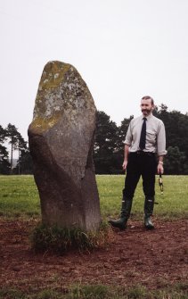 View of rubbing stone from SW, with Dr Iain Fraser (RCAHMS) in picture