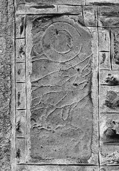 General view of Pictish stone bearing half of a double-disc and Z-rod above the body of an eagle.