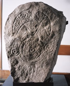 General view of Pictish stone bearing a crescent and V-rod above a triple-disc symbol.