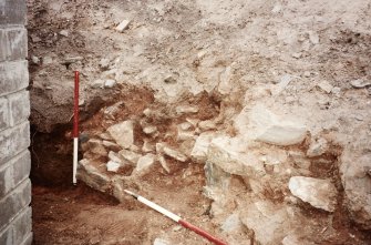 Excavation photograph : wall 12, looking west from back of no.13.