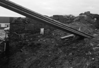 Excavation photograph : midden (9) on north side of wall (8).