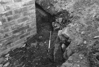 Excavation photograph : detail of wall (12) looking west.