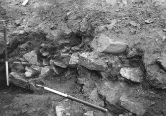 Excavation photograph : detail of wall (12) looking west.