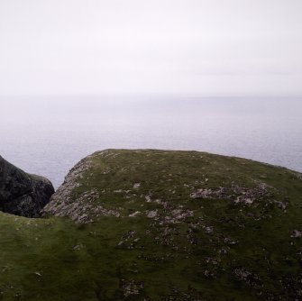 General oblique aerial view of the S side of Guarsay Mór, taken from the NE.