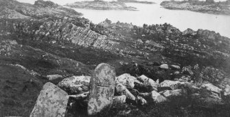 Eileach An Naoimh, incised cross on stone (site of Eithnie's grave?).
General view.
Insc: 'This is locally regarded as the site of the tomb of the mother of St. Columba. The incised stone in the foreground is certainly very ancient.'