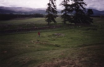 View of building (3d) and enclosure (3e) from SE.