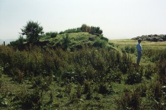 Photograph showing cairn with Peter Yeoman of Fife Regional Council in foreground.
