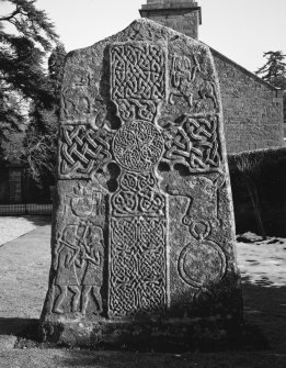 Pictish cross slab in manse garden, view of west (front) face (sunlight)