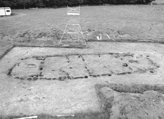 Site under excavation. Hi-spy view from SE with ranging poles.