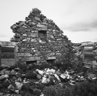 Detail of W gable (interior) showing double fireplaces in ground floor.