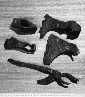 Smith's Hammer & Tongs Adze Head and two axe heads (NMA Nos  IL 133, IL   , IL 134, IL 131, IL 130 1877) RCAHMS 1982