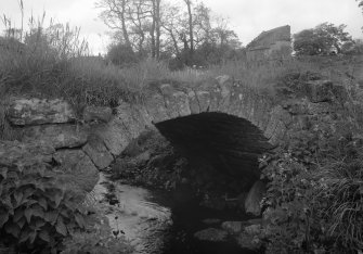 General view of Kirkwynd footbridge, Kilrenny, with Innergellie House dovecot visible in the background.