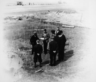 Excavation photograph : L M Mann with visitors to site. 'Received 12th August., 1937 from Mr Jay'(?).