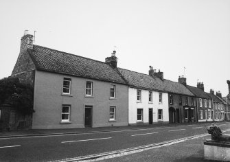 View of row of dwellings opposite the Red Lion Hotel, High Street, Ayton (Numbers 41-37 from the left).