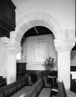 Interior.
View of pews and arch.