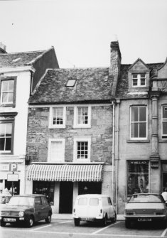View of unidentified shop and W Millar on the right.