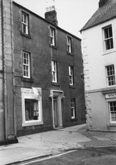 View of unidentified shop and section of an off license.