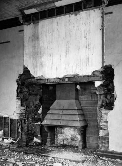 Interior.
First floor, N room, detail of W fireplace.