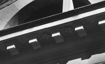 Detail of W elevation central entrance bay cornice supporting pediment.