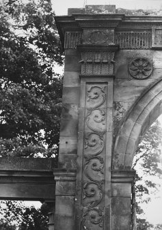 Detail of stonework on NW side of entrance archway.