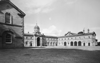 View from SW showing N and E courtyard elevations.