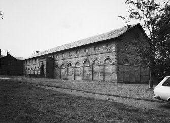 View of Riding School on E side of stables.