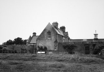 View of house and attached farmsteading, showing the clock tower.